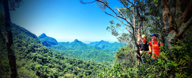 Two hikers on the summit at Tijuca Forest