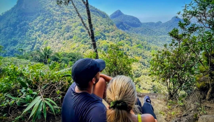 Couple enjoying a scenic mountain view.